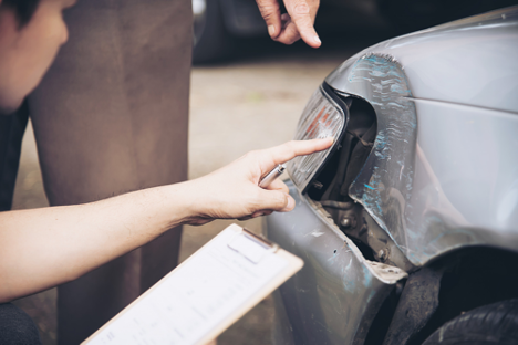 checking car accident damage