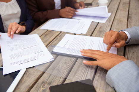 People reviewing legal documents