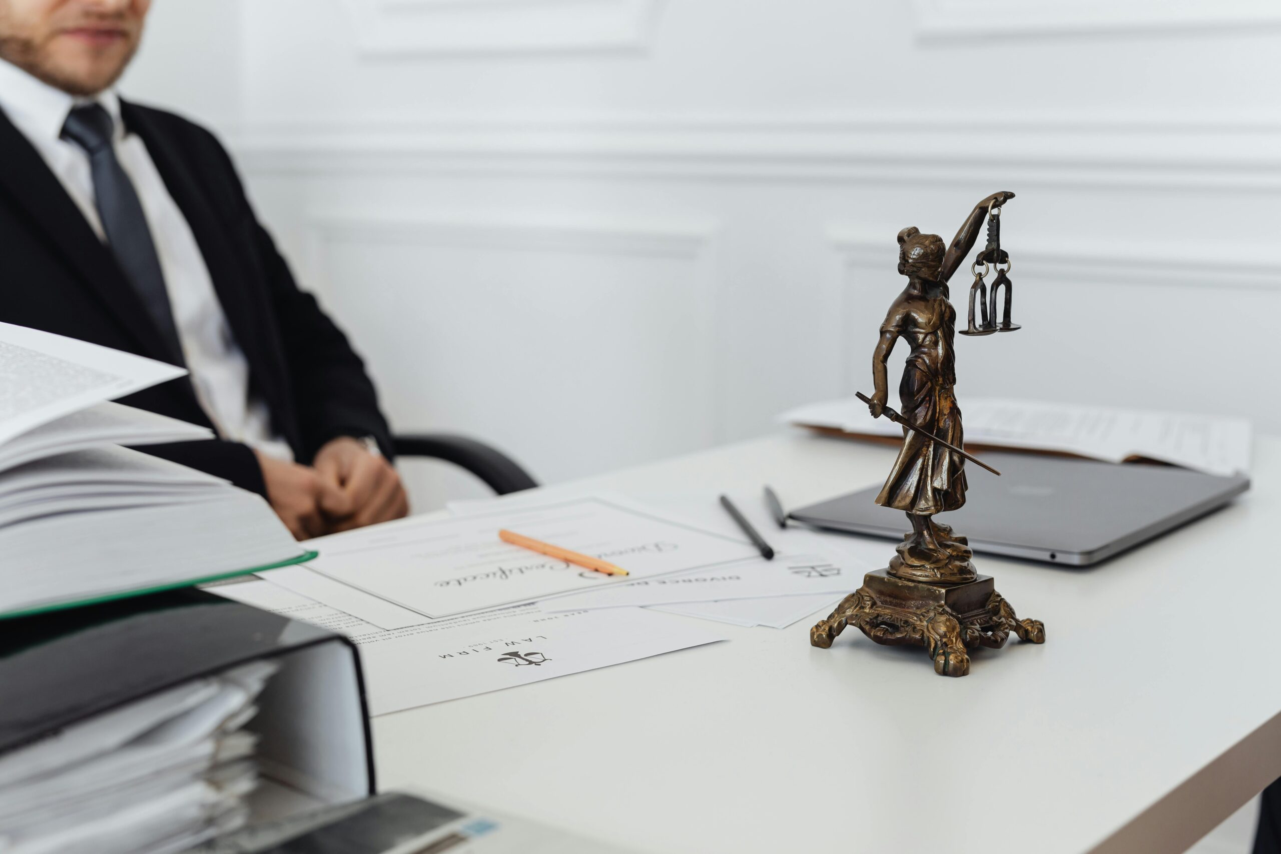 a lawyer in his office with files on the table